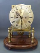 A brass skeleton clock with two train double fusee movement, striking on a bell,