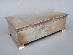 A George V hallmarked silver Art Nouveau style cigarette box,