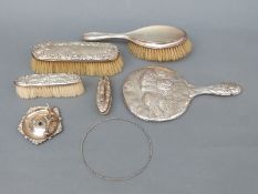 A quantity of hallmarked silver and white metal-mounted dressing table items comprising cherub hand