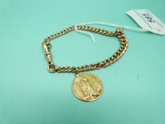 A 9ct gold bracelet made up of graduated curb links with a 9ct gold St Christopher charm/pendant