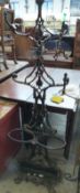 A cast iron hat/coat stand with umbrella/stick stand and drip tray,