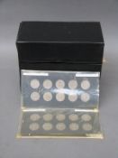 An amateur collection of English shillings mounted in cards, ranging from 1960-1966,