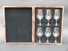 A set of six Remy Martin glasses in original wooden