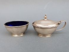 A George V hallmarked silver mustard and open salt with blue glass liner, Sheffield 1932,