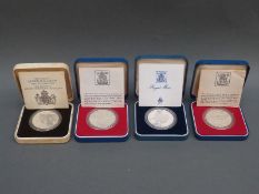 Four cased Royal Mint silver proof Royal commemorative crowns to include Queen Mother 80th Birthday,