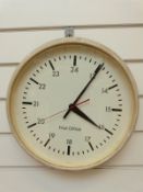 A c1970s Post Office dial wall clock with baton numerals and Arabic 24 hour,