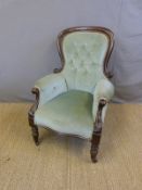 A 19thC mahogany-framed button-back armchair