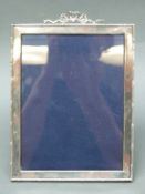 An Edward VII hallmarked silver photograph frame to suit 8x6inch photo,