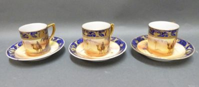Noritake coffee cans and saucers decorated with desert scenes