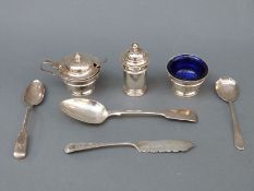 A George V hallmarked silver three-piece cruet set comprising salt, mustard and pepper,