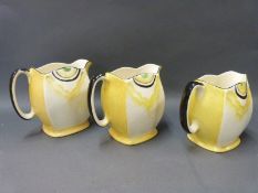A set of three graduated Art Deco jugs,