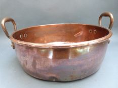 A 19thC copper and bronze twin-handled bowl,