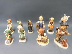 Ten Goebel Hummel figures including boy with ladder,