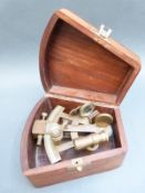 A small brass sextant in wooden box