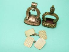 A pair of 9ct gold cufflinks with engine turned decoration (3.