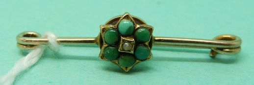 A Victorian forget-me-not brooch set with turquoise and a seed pearl,