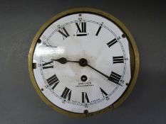 A Smiths brass cased ship's bulkhead timepiece with Cricklewood NW2 to white enamelled Roman dial &