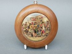 Prattware pot lid 'The Parish Beadle after Wilkie' 7.5cm in diameter, in turned wooden frame.