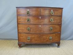 A 19thC mahogany bow front chest of two over three drawers (W114 x D56 x H104cm)