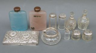 A quantity of hallmarked silver-mounted cut glass dressing table bottles, plated embossed box top,