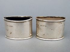 A pair of George V hallmarked silver open salts, one with blue glass liner, Sheffield 1917 and 1918,