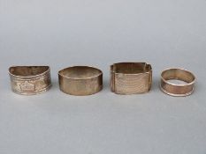 Four various hallmarked silver napkin rings,