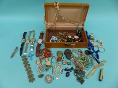 A collection of costume jewellery including brooches, watches, silver cameo ring,