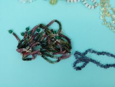 A collection of necklaces including moonstone, aquamarine and pearl,