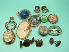 A collection of jewellery to include two white metal pendants/ brooches set with cameos,