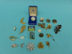 A collection of brooches set with paste,