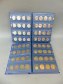 Two coin wallets containing an amateur coin collection,