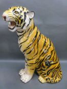 A ceramic fireside tiger cub,