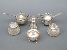 A hallmarked silver three piece cruet set, further lidded mustard with blue glass liner,