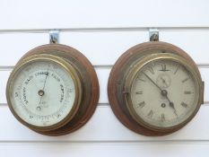A brass cased Short & Mason ship's bulkhead clock with Roman dial and matching barometer,