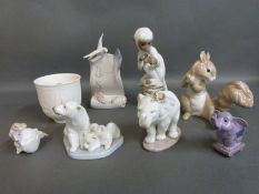 A collection of boxed Lladro figures including squirrel, Japanese monkey with slip cover,
