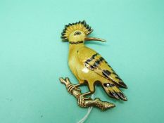 A silver gilt brooch in the form of a Hoopoe set with guilloche enamel