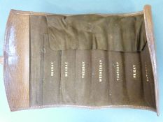 Leather travelling case with sections for each day of the week,