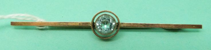 A 9ct gold brooch set with a round cut aquamarine