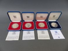 Four cased Royal Mint silver proof Royal commemorative crowns with certificates