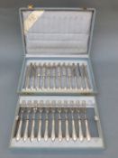 A cased set of dessert knives and forks,