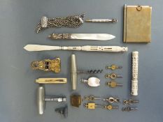 A quantity of collectables to include mother of pearl letter opener, watch keys,