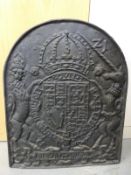 A cast iron fire back with Royal coat of arms,