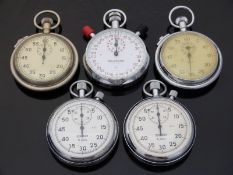 Five various stopwatches including Balmaster, Smiths and Sekonda.