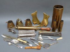 A quantity of brassware to include trench art ashtrays, shoe stands,