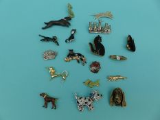A collection of brooches in the form of cats and dogs including wooden,
