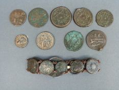 Nine Roman coins mounted as a bracelet together with five other ancient coins including Roman