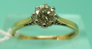 An 18ct gold ring set with round brilliant cut diamond of approximately 0.