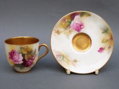 Royal Worcester miniature cabinet cup and saucer decorated with roses, the cup signed M Hunt,