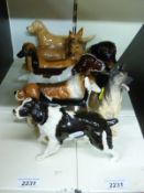 Ten Beswick and Royal Doulton dogs including large spaniel, collies,