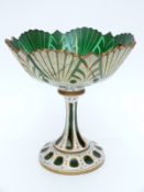 Overlaid and cut glass tazza with white casing over green ground highlighted and ornately decorated